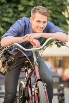 Man with bicycle Stock Photos