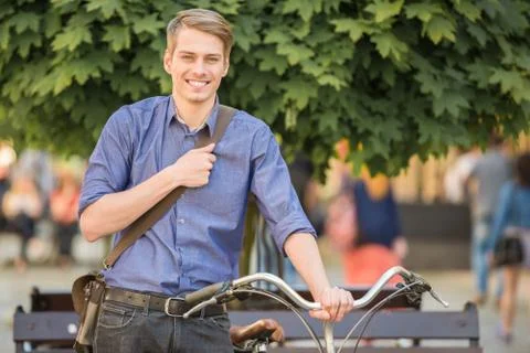 Man with bicycle Stock Photos