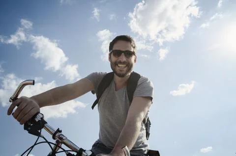 Man with bicycle Stock Photos