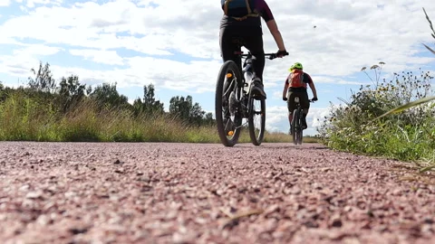 A man on a bicycle rides on the road in summer. Travelling by bike. Stock Footage 208938203