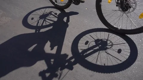 Man Bicycle shadow running on the road Video stock 72724586