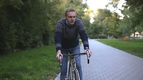 Man on bicycle talking Stock Footage 54359971