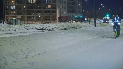 The man on a bicycle in a winter evening. Stock Footage 171655918
