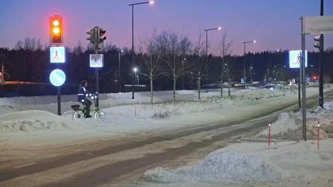 The man on a bicycle in a winter evening. Stock Footage 171655935