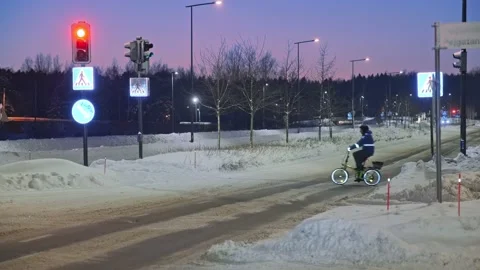 The man on a bicycle in a winter evening. Stock Footage 171655974