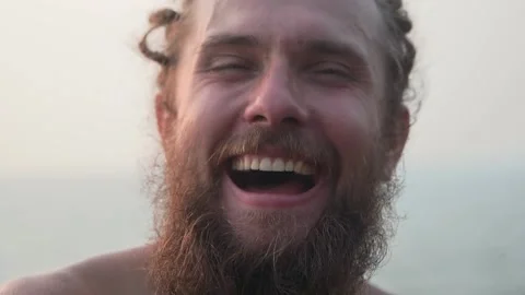 A man with a big beard and an expression of joy, smiling broadly Video stock 234021383