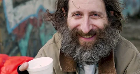 Man with a big beard smiling and laughing while looking at the camera Stock Footage 143482346