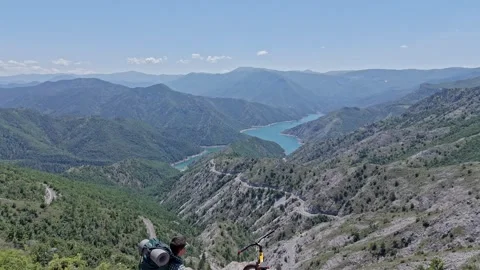Man with a bike on a mountain 스톡 동영상 277452500