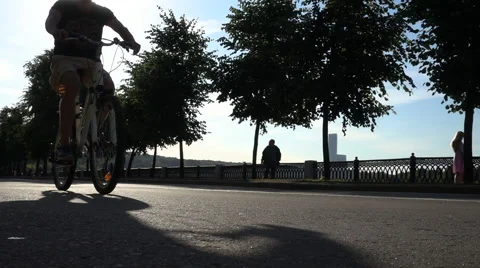 A Man Is Biking At Sunset Stock Footage 64638617