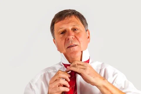 Man binding his tie Stock Photos