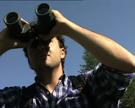 Man with binoculars CLOSE UP Video stock 12757270