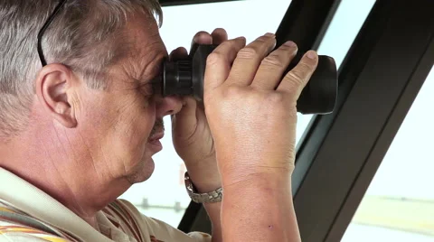Man with binoculars look at the sea Stock Footage 61806258