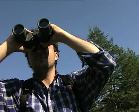 Man with binoculars MS Stock-Footage 12757186