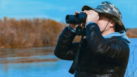 Man with binoculars Stock Photos