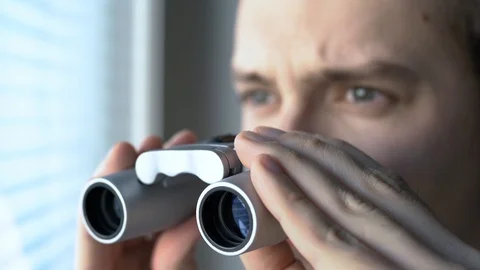 Man with binoculars. Private detective, agent or investigator. Stock Footage 123701155
