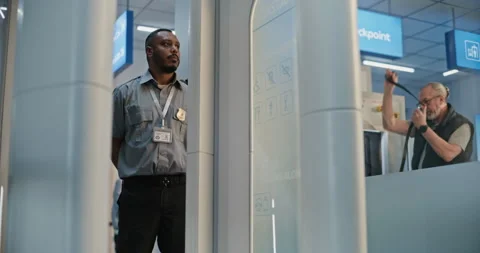 Man with Bionic Prosthetic Leg Walking Through X-ray Metal Detector Scanner in 스톡 동영상 307375244