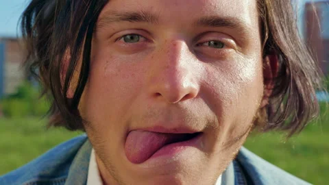 A man is biting a cheeseburger with great appetite Video stock 154210654