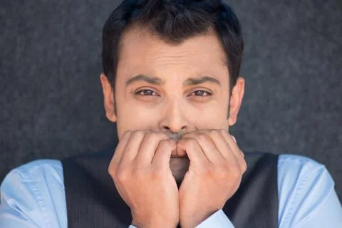 Man biting fingernails Stock Photos