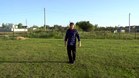A man in a black baseball cap gives a thumbs up 4K Video stock 325988039