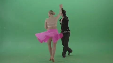Man in black dance suit spin his partner in pink dress isolated on green Stock Footage 147927219