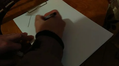 A man with a black felt-tip pen writes a large word - Taxes Stock Footage 168488492