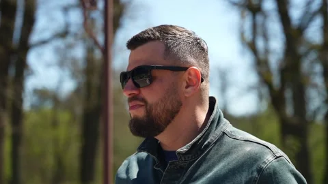 A man in black glasses is talking to himself Stock Footage 246769179