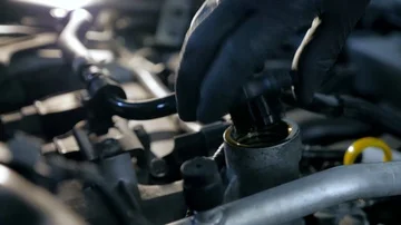 Man in black gloves open engine oil cap close up 4k Stock Footage 86069183