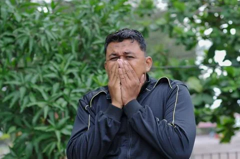 A man with black jacket sign language Foto stock