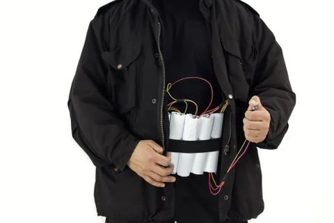 Man in a black jacket strapped with explosives and detonator holds in his hand, Stock Photos