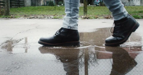 A Man In The Black Leather Boots Walks On The Pond Stock Footage 234410522