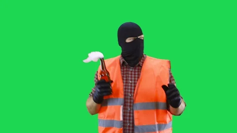A man in a black mask protests in his hands an incendiary mixture. Video stock 129751088