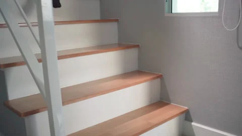 Man in black pants walk down on stairs from 2nd floor to 1st floor side angle Stock-Footage 158380400