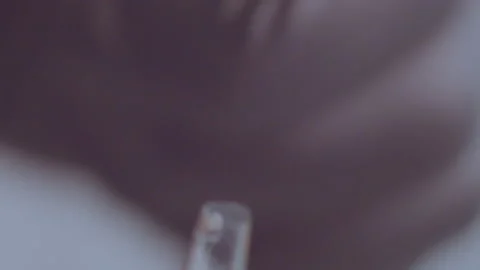 A man in black rubber gloves opens an ampoule with a medicine, close-up Stock Footage 159744686