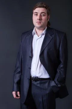 Man in a black suit Stock Photos