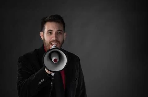 Man in Black Suit Speaking Using Megaphone Stock Photos