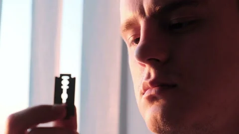 A man with a blade in his hands, close-up Stock Footage 131084198