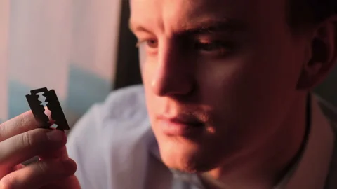 A man with a blade in his hands, close-up Stock Footage 131084447