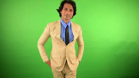 Man in blazer stands smiling looking confident Stock Footage 297599256