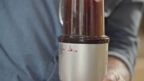 Man blending coffee in the blender Stock Footage 83186287