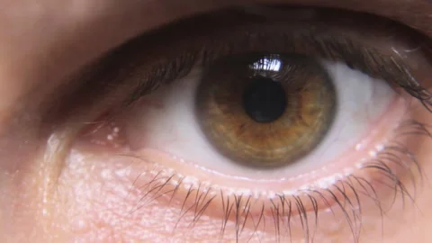 Man blinking his wide open eye close up Video stock 203840089