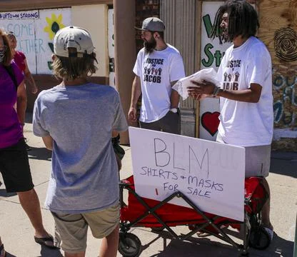 Man with "BLM" poster Stock Photos