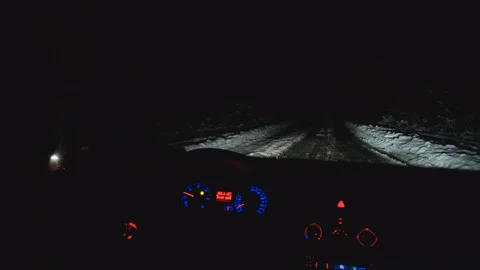 The man block the road for a car in the forest. night time 库存影片 83734740