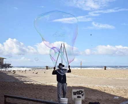 A man blowing big bubbles Foto stock