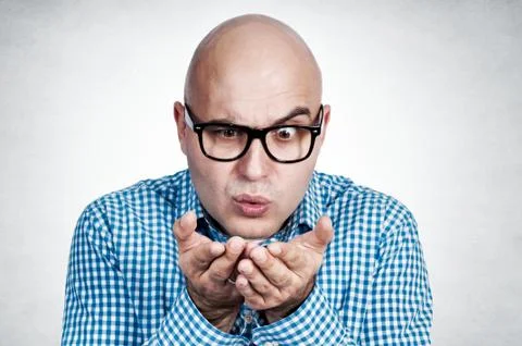 Man blowing hand Stock Photos