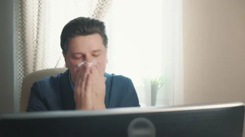 Man blowing his nose into a tissue. catarrhal condition Stock Footage 171964587