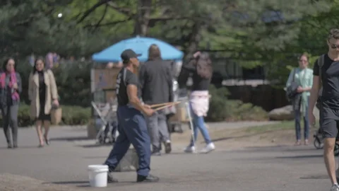 Man blowing magic bubble in the park Stock Footage 114246730