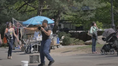 Man blowing magic bubble in the park Stock Footage 114246731