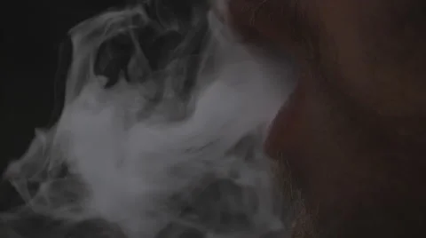 Man Blowing Smoke Macro Slow Motion Video stock 63621124