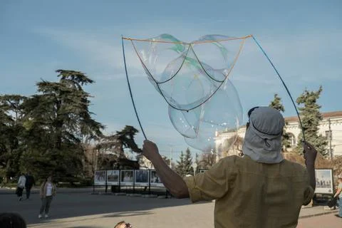 Man blows bubbles. Stock Photos