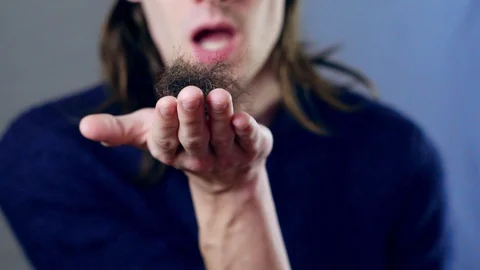 The man blows into the camera Stock Footage 111122520